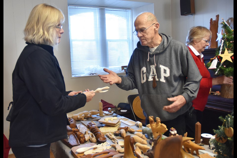 Wood carver Howard Greenaway talks to Anne Kell about the care and finishing of a carved wooden spoon. Miriam King/Bradford Today