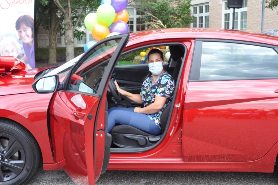 Bradford Valley PSW Sonia Botas won the grand prize 2021 Hyundai Elantra from a vaccination contest run by Sienna Senior Living and in partnership with Raptors Superfan Nav Bhatia who owns the Mississauga Hyundai dealership and runs the Raptors Superfan Foundation. 