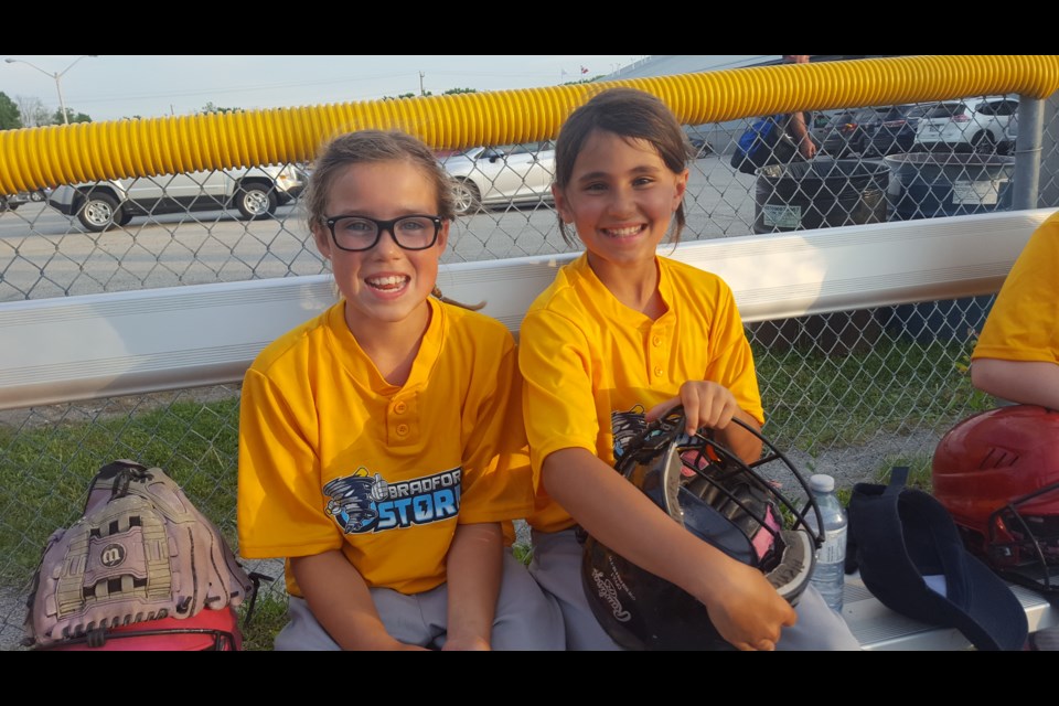 Mite Softball players Claire and Alexis from Home Hardware waiting for their game to start. Submitted photo 