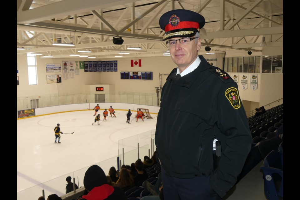 South Simcoe Police Chief Andrew Fletcher checks out the third annual Copper Cup. Jenni Dunning/BradfordToday