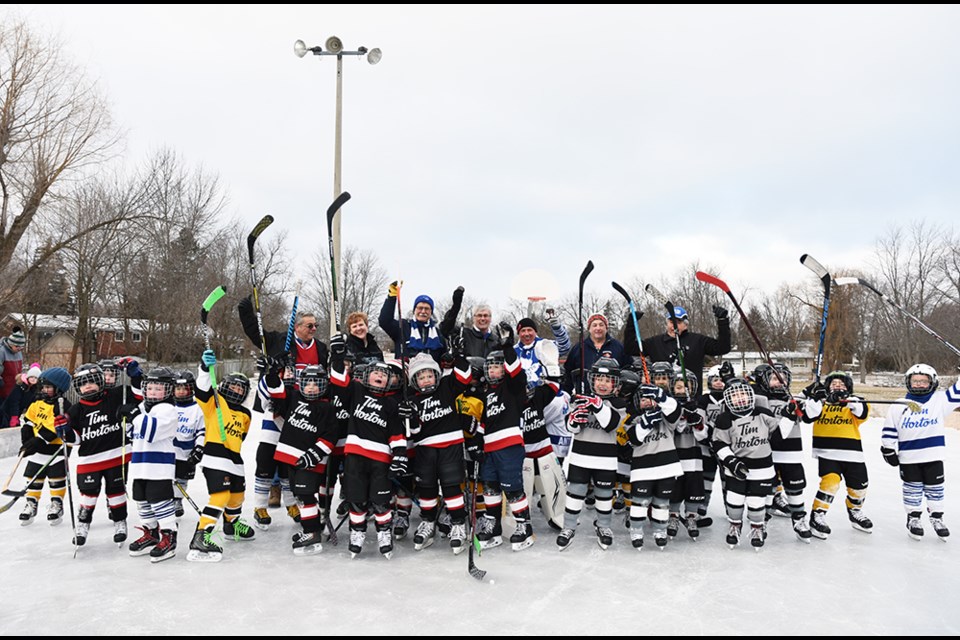 Members of BWG Council, including Mayor Rob Keffer and Deputy Mayor James Leduc, join young IP Hockey players for the start of Hockey Day in BWG, Feb. 9. Miriam King/Bradford Today