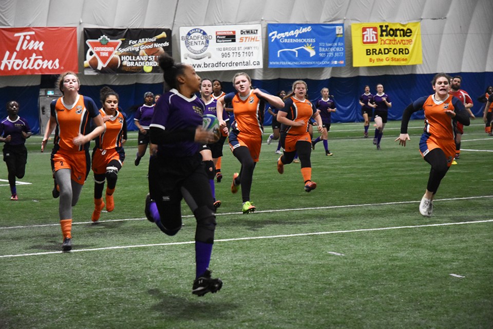 Innisdale girls in pursuit of the St. Roch team, in possession of the ball. Miriam King/Bradford Today