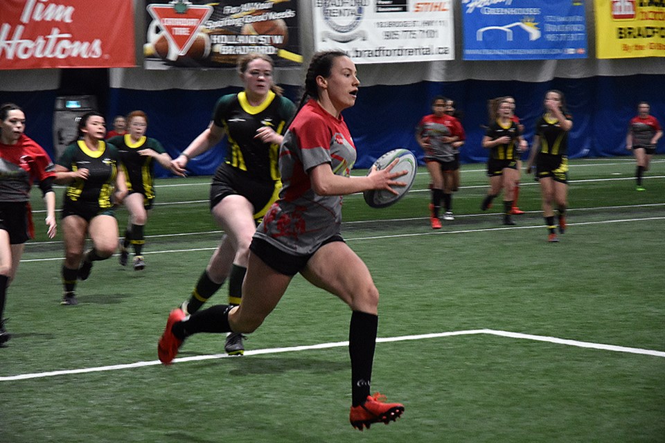 Guelph player heads toward the try line, in Jr. Girls Rugby action against the Barrie North Vikings. Miriam King/Bradford Today