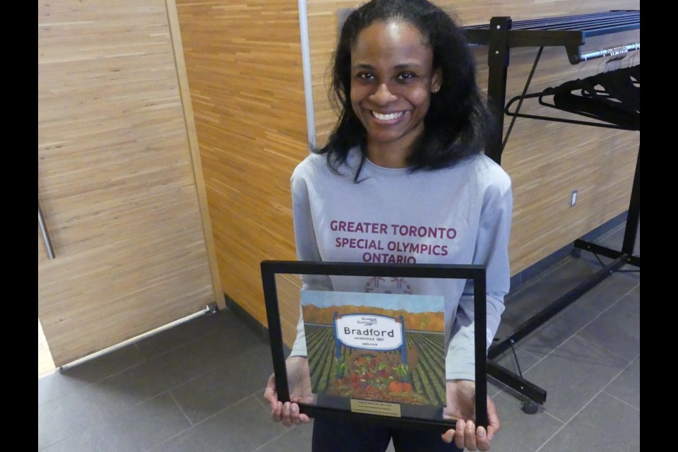 Monique Shah with a painting given to her by BWG council to honour her contributions to Special Olympics. Jenni Dunning/BradfordToday