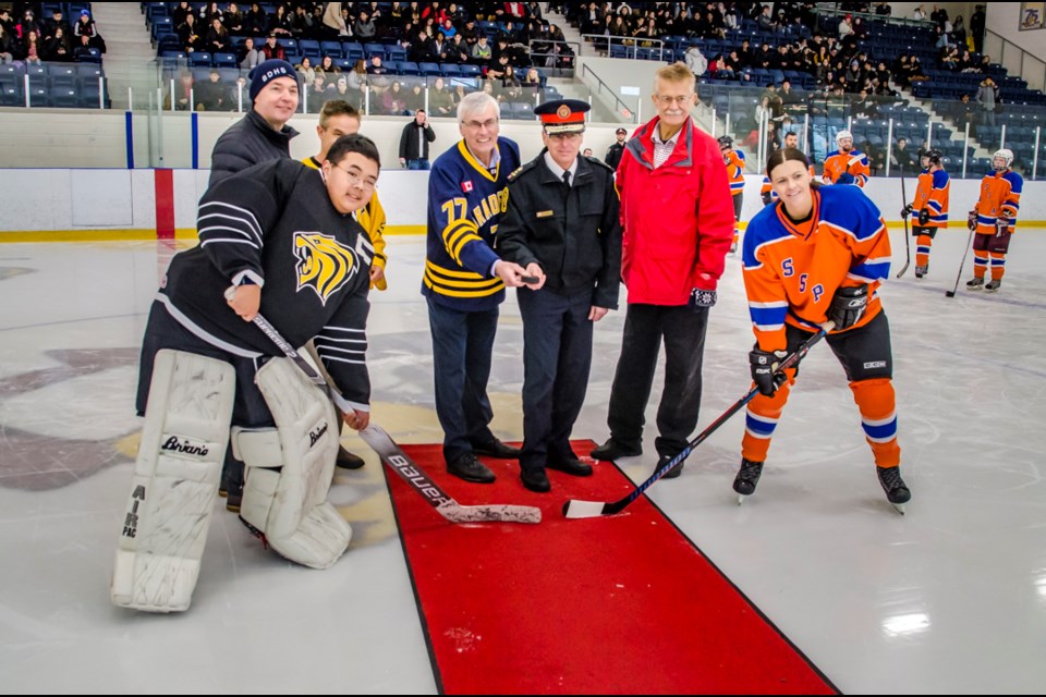 South Simcoe Police Chief Andrew Fletcher and BWG Mayor Rob Keffer are joined by BWG Councillor Gary Baynes, BDHS Principal Peter Stone and Holy Trinity CHS Principal Heinrich Bebie for the ceremonial puck drop of the 2019 Copper Cup. Dave Kramer for BradfordToday.