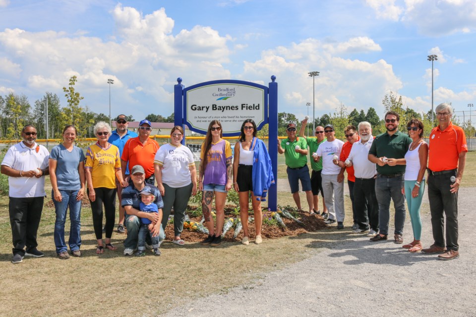 Baynes family, members of the community and town council at the baseball diamond unveiling Aug. 20, 2022