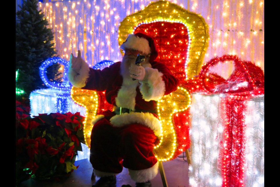 Santa Claus is one of the stars of Christmas Glow at Bradford Greenhouse Gallery in Barrie. Andrew Hind photo