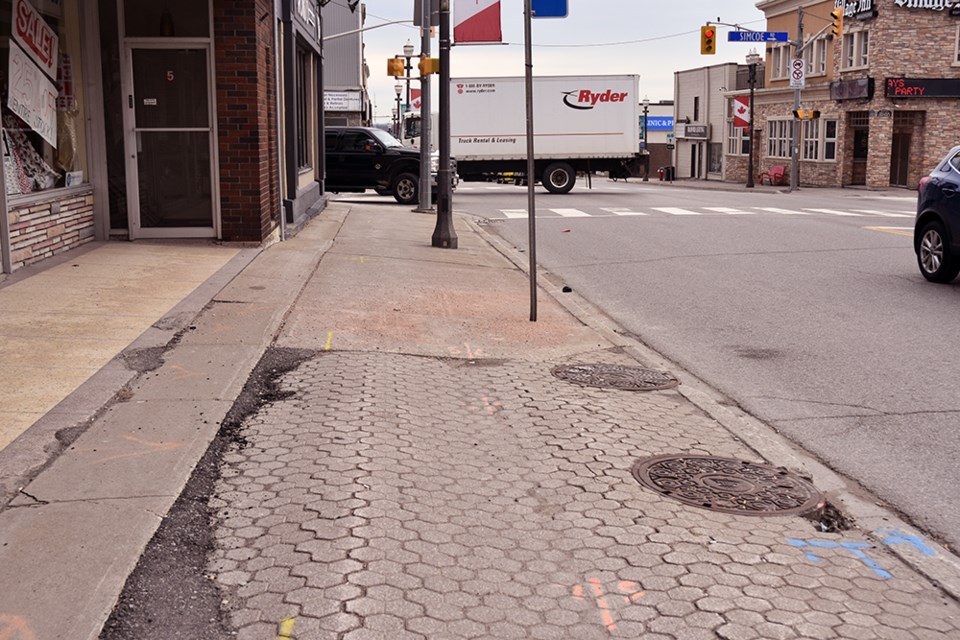 Downtown Revitalization Committee has recommended replacement of broken and uneven sidewalk pavers on Holland St. West. Miriam King/Bradford Today