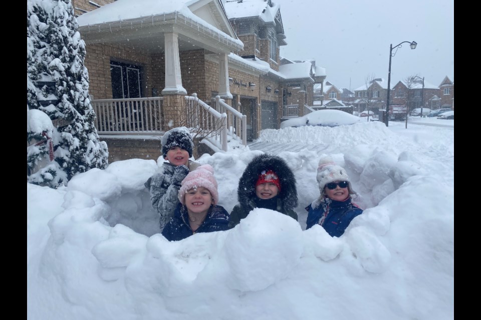 Peek-a-boo! Building snow forts with neighbours