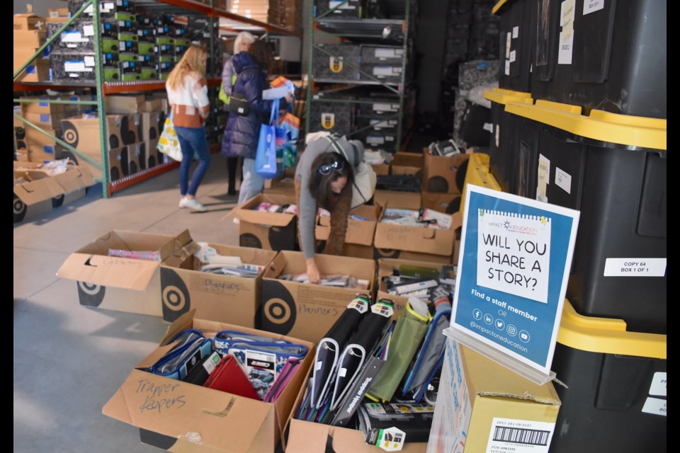 Boulder Valley School District teachers peruse piles of school supplies donated by Target at the FOSS Center on Arapahoe Avenue. 