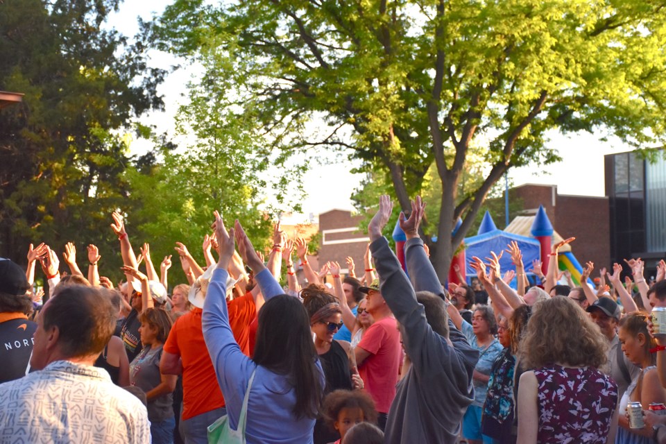 Pato Banton fans raise their hands during his performance on Friday in Longmont.