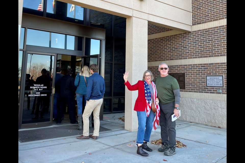 Bette Erickson, former Broomfield mayor pro-tem (left) and Broomfield resident Patrick Browne (right) cast their votes in person at the George Di Ciero City and County Building on Election Day.