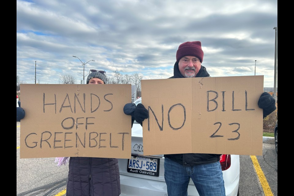 Protesters lined the intersection at Brant Street and North Service Road during the rally organized by Stop Sprawl Halton and Environmental Defence Nov. 19.