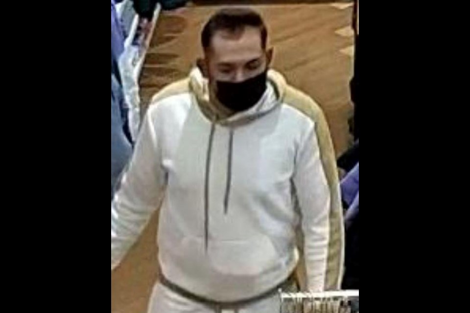 Suspect one: A 6-foot tall Hispanic male approximately 40 years of age and about 200 lbs. Wearing a white and tan sweater, white shorts and black running shoes and a black medical mask.