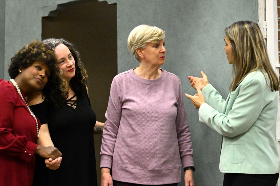 Actors (left to right) Ifrah Bruce, Nikki Blain, Val Clements and Linda Spence rehearse a scene for the Theatre Burlington production of Remember, Maggy?