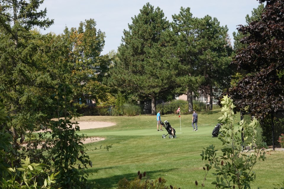 Golfers enjoy a round of golf at Millcroft Golf Club Wednesday afternoon.