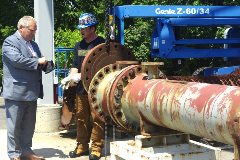 Premier Doug Ford visited the International Brotherhood of Boilermakers Local 128 this afternoon to announce a $535,000 investment to help train new boilermakers. Here, pre-apprentice Shawn Verlinde shows the Premier some of the equipment.