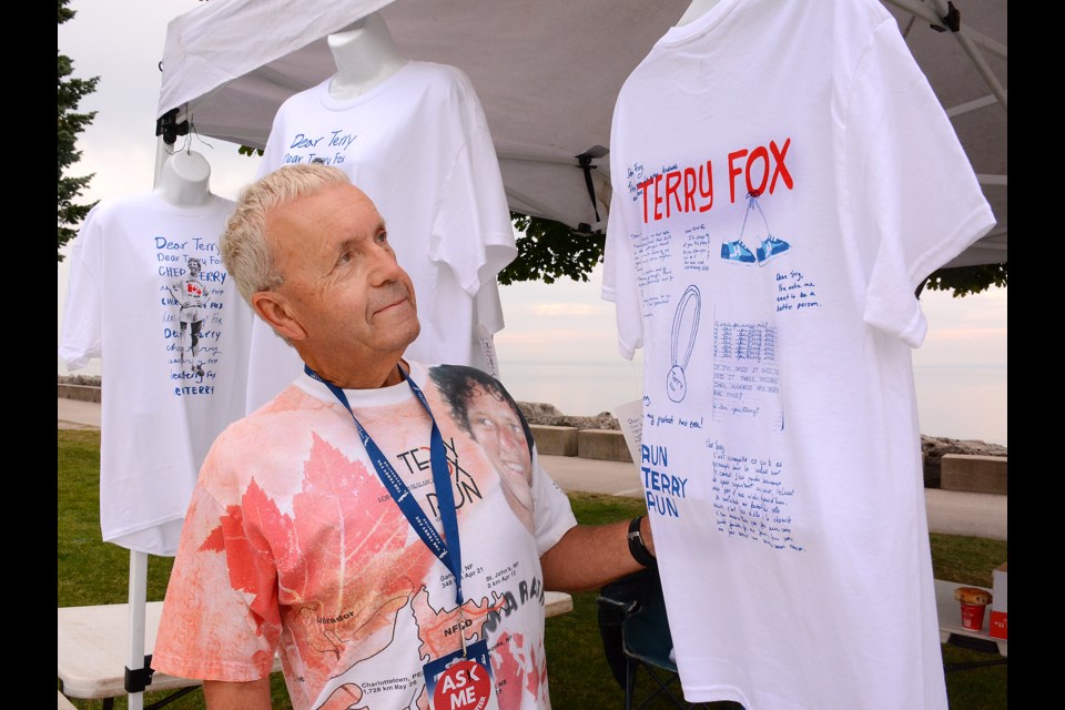 Burlington Terry Fox Run committee member Rick Craig with some of the t-shirts  available during Sunday's event at Spencer Smith Park.