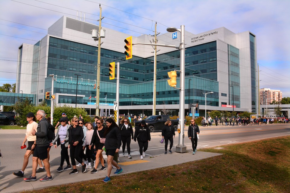 Participants leave Joseph Brant Hospital for the Walk to the Lighthouse Sunday morning.