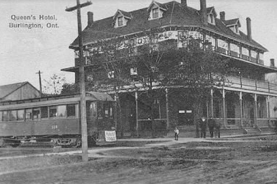 A post card depicting the Queen's Hotel with a radial car out front, postmarked May 10, 1913.