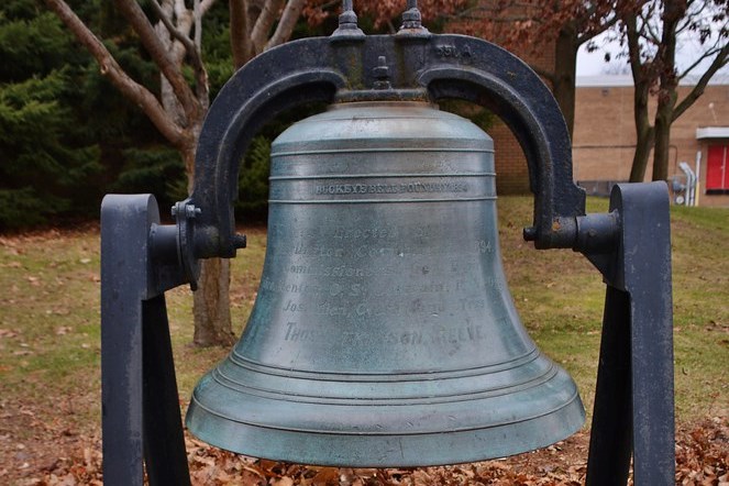 The Town Bell was erected permanently at the north entrance of the Central Library.