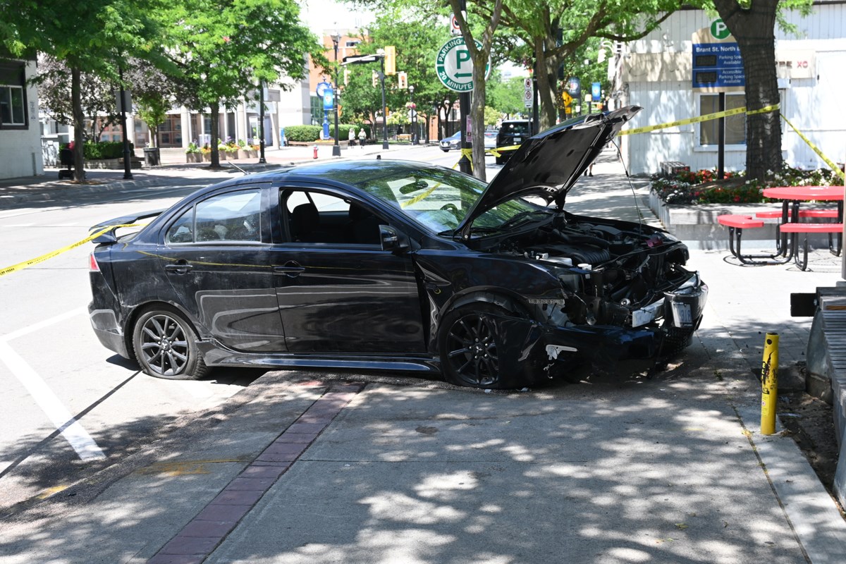 Emergency services are on the scene downtown after a car collided with an outdoor bench