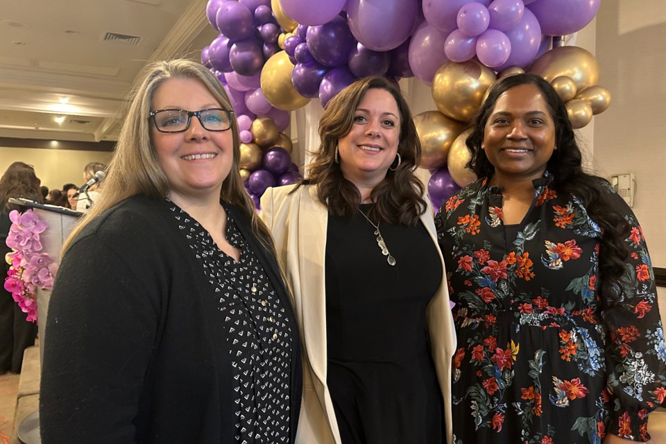 (Left to right) Halton Women's Place HR staff member Yvette Drake, Executive Director Laurie Hepburn and public education team lead Jerusha Mack pose for a photo during the International Women's Day lunch at Holiday Inn March 8.  
