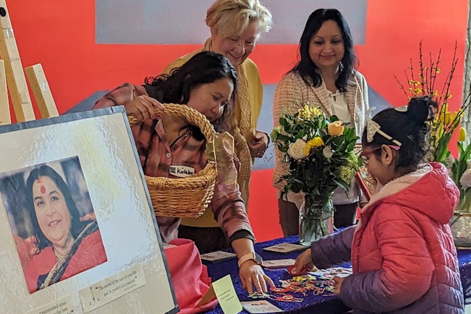 Gift giving was part of the celebration at the Festival of New Beginnings at Burlington Art Gallery March 18.