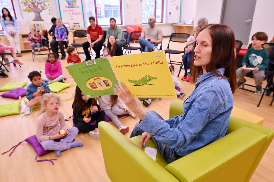 It was storytime at the HUB on Sutton Drive on Saturday morning, and the children were hearing all about reptiles. Mike Biernacki of the Reptile Store brought along a few friends like a Bearded Dragon, a tortoise and an African Python. Pixie Vamp reading I'd Really Like to Eat A Child.