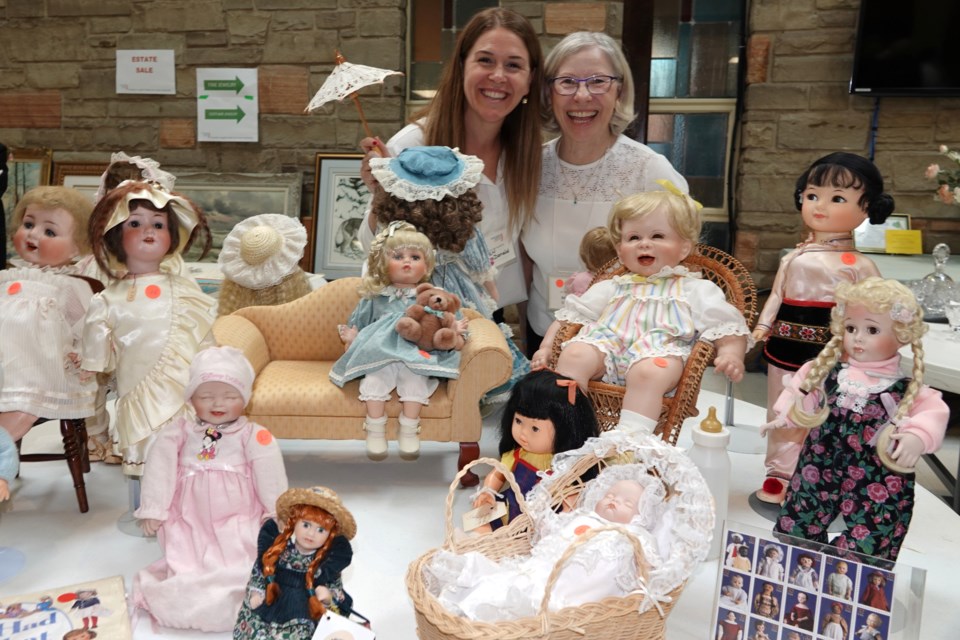 Jennifer MacDonald (left) and Barbara Lawton, JBH auxiliary spring marketplace volunteers with some of the dolls that were for sale.