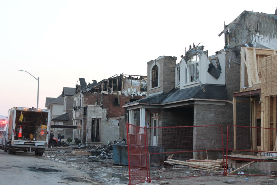 Halton Police, Burlington Fire and cleanup crews remain on Koenig Road in North Burlington this evening, after a fire tore through several homes in the early hours of Aug. 19.