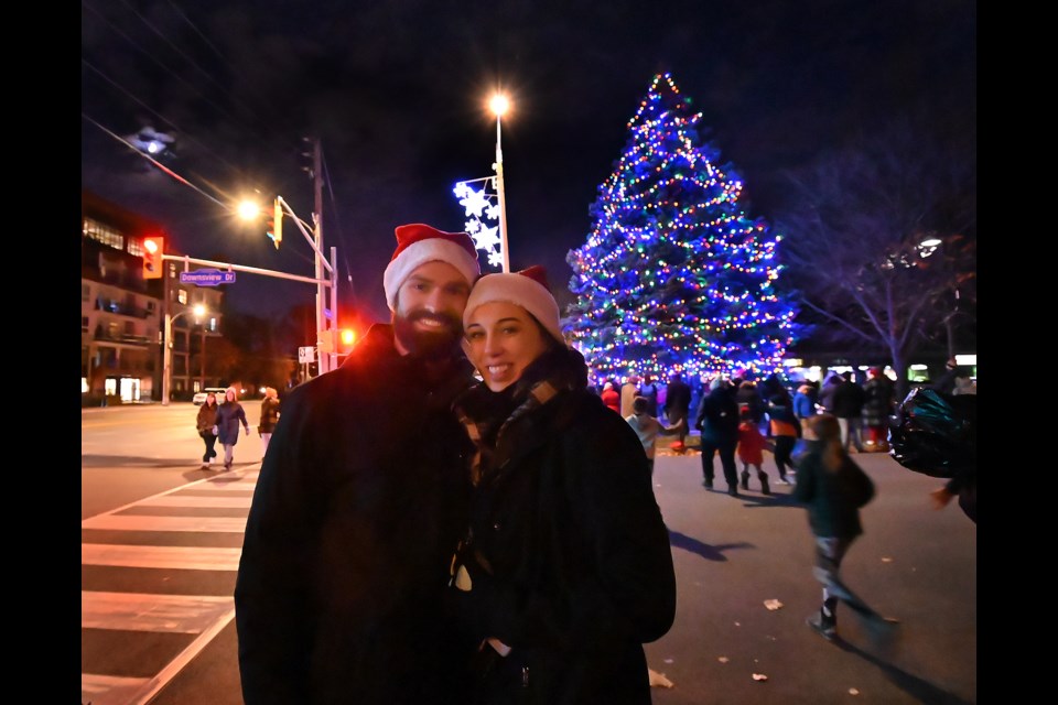 Jenna Lehroux and Curtis Richards enjoy the tree lighting in Aldershot Saturday evening.