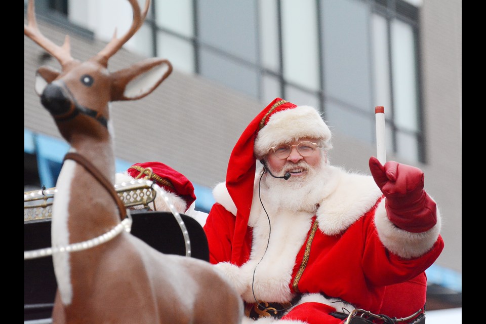 Burlington families give Santa a warm at today's parade