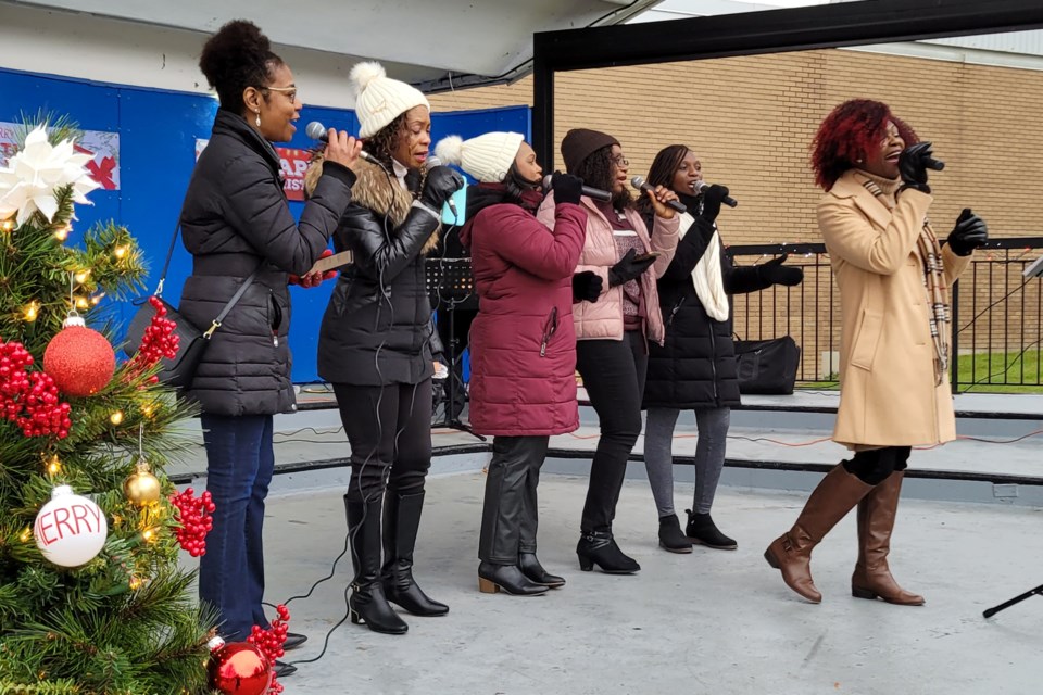 The Arise and Shine Music Ministry choir performs at the Central Park Bandshell Saturday afternoon.