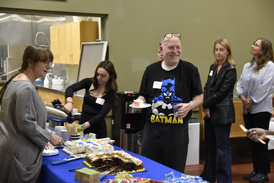 The celebration gave volunteers and chance to meet and chat with one another over coffee and cake. Here, Community Development Halton's Rishia Burke serves some cake.
