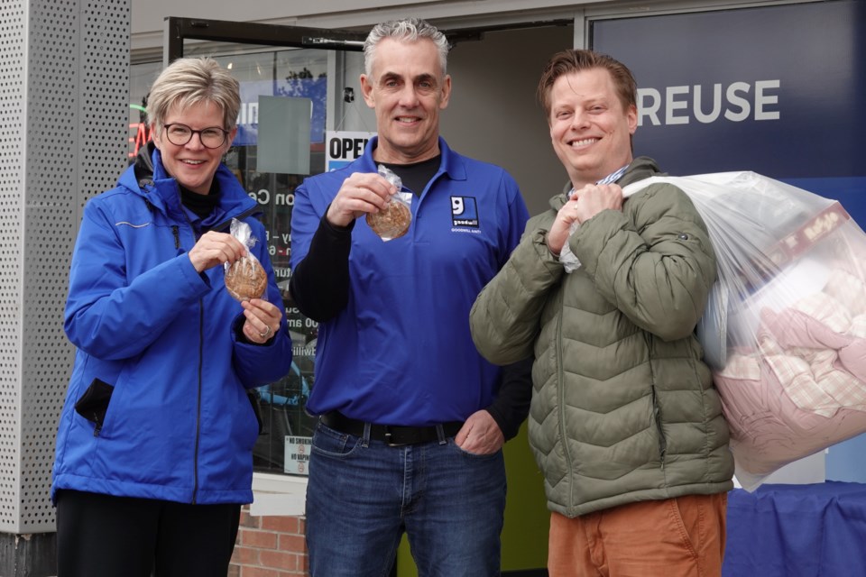 Goodwill Amity and Ward 3 councillor Rory Nisan (right) cohosted a donation drive today at the 2501 Guelph Line location. Here, he collects a donation along with Kelly Duffin, CEO of Goodwill and Gary Cavanagh, vice president, social enterprises.