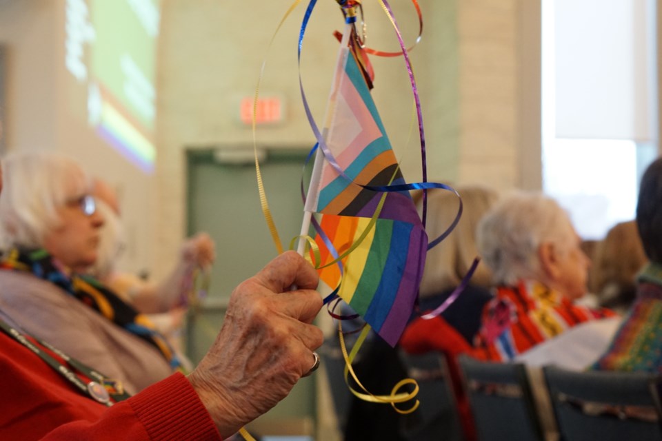 Attendees were given ribbons and flags to wave during the mass. 