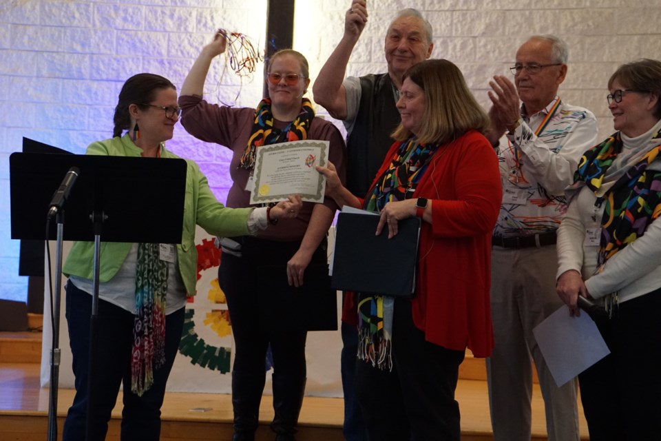 Members of the church receive their affirming certificate. 