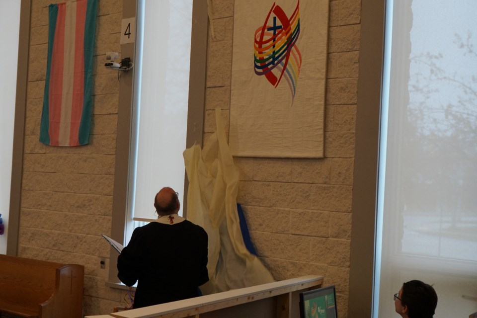 A new banner, celebrating the 2SLGBTQIA+ community, will fly in the church. 