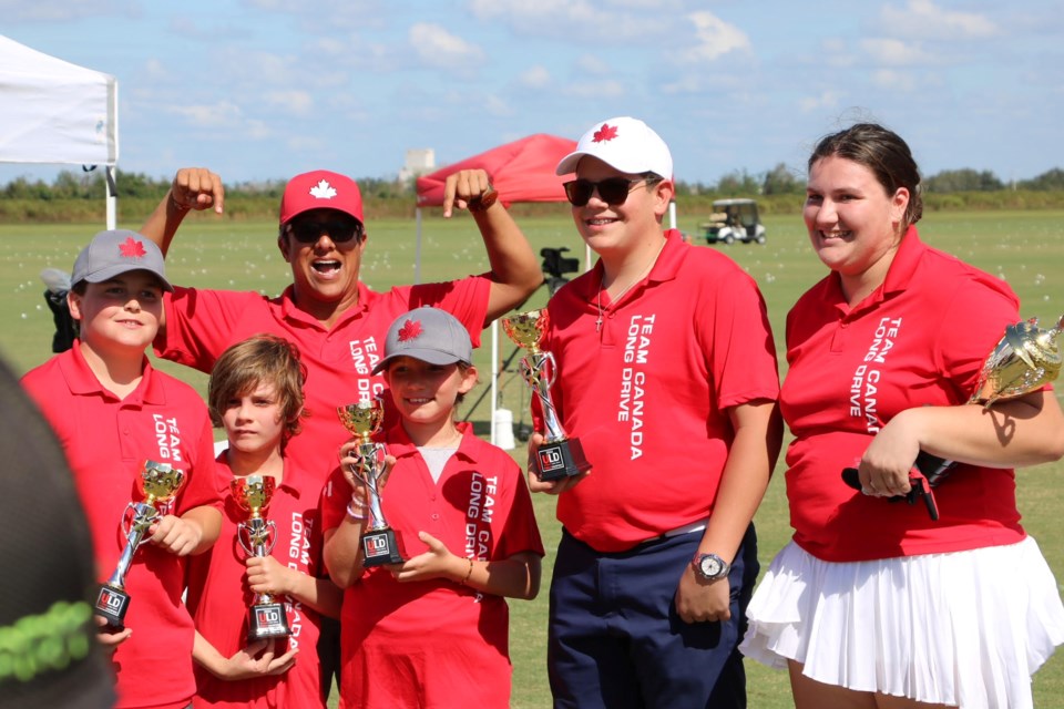 Fareen Samji (in red hat) and Team Canada celebrate winning the junior ALD world long drive championships.
