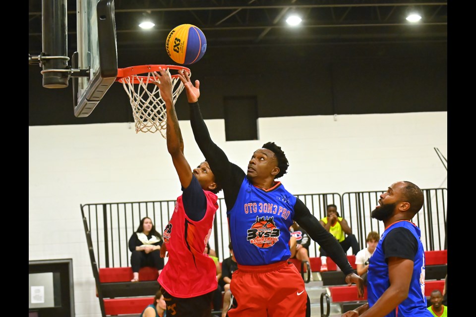 An OTG 3on3 Pro player (in blue) goes up for the ball against a Stay Strapped player. OTG  won the matchup 20-6 and later went on to the final, where they were defeated by the GTA Ballers.