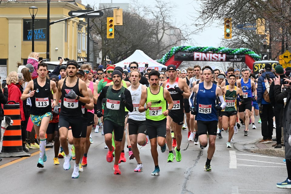 The race begins with 3,200 runners heading north on Brant St. at City Hall.