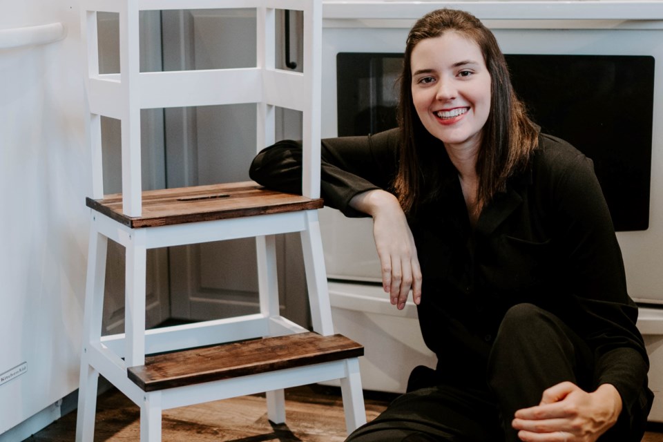 Rachel Adetoyo leans on one of the learning towers that is used regularly in her Burlington home.