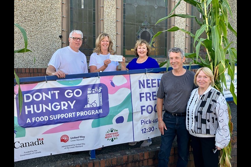 Back, left to right: Mike Crean, past president of the Rotary Club of New Westminster; Laurie Stewart, president of the Rotary Club of New Westminster; and Rev. Laurie McKay at the St. Aidan’s Presbyterian Church. Front, Rotarian volunteers Rick Carswell and Maxine Searle. 