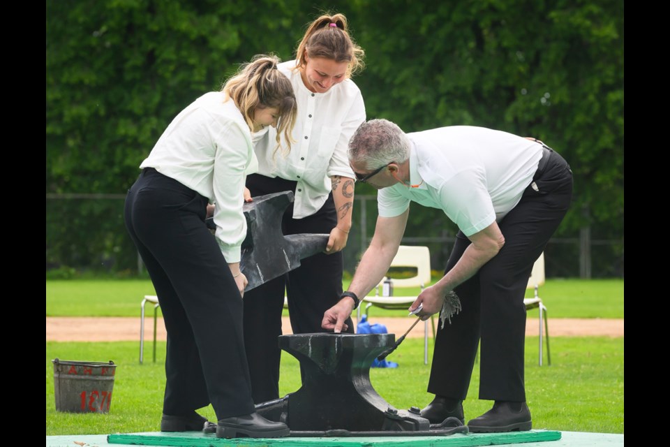As rookies, Melissa Flintoff and Mary McQueen are "hoisters" with the anvil battery, while Chris Dupuis is a veteran with the group.