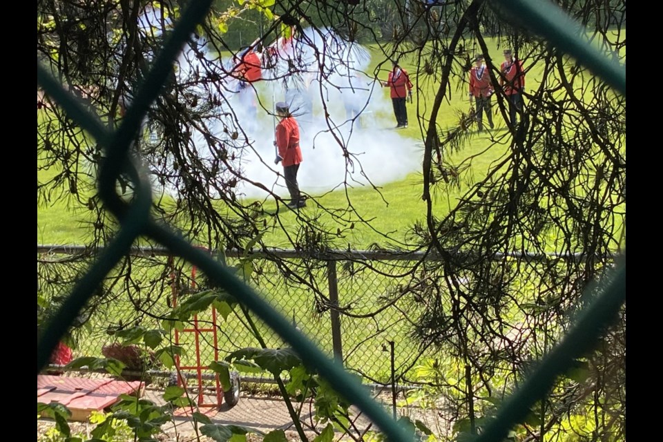 The Ancient and Honourable Hyack Anvil Battery fired a 21-anvil salute on Victoria Day in Queen's Park Stadium. The stadium was closed to the public, so folks watched from outside the fence.