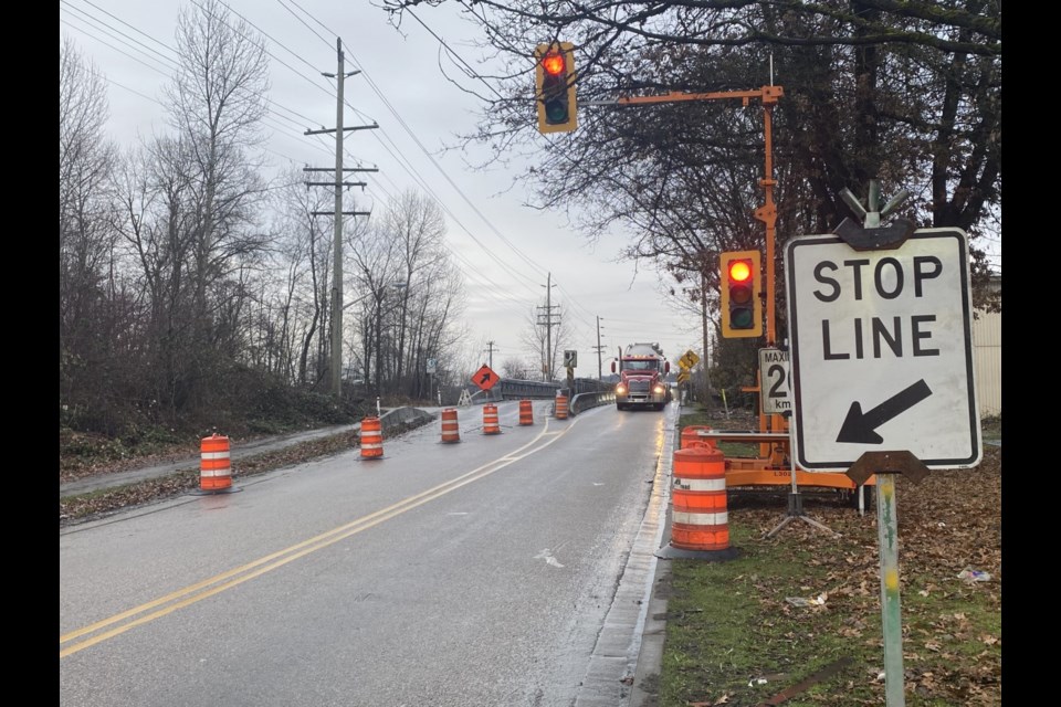 One lane of the Bailey Bridge is closed to traffic while repairs are being done to the wood decking.