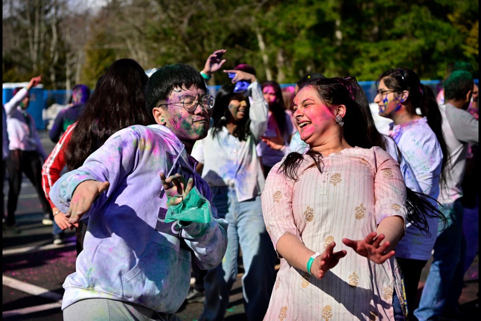 Leon Lee and Tanvi Aneja dance at the 2023 Holi Bash Bura Na Mano Holi Hai event at Simon Fraser University on March 5, 2023.