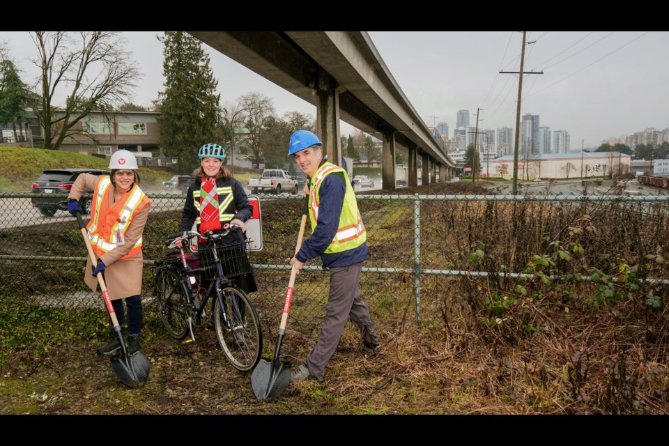 Emily Mak of Southern Railway of BC, Sarah Ross of TransLink and Mayor Patrick Johnstone, from left, are thrilled that improvements are coming to the BC Parkway in near Stewardson Way in New Westminster.