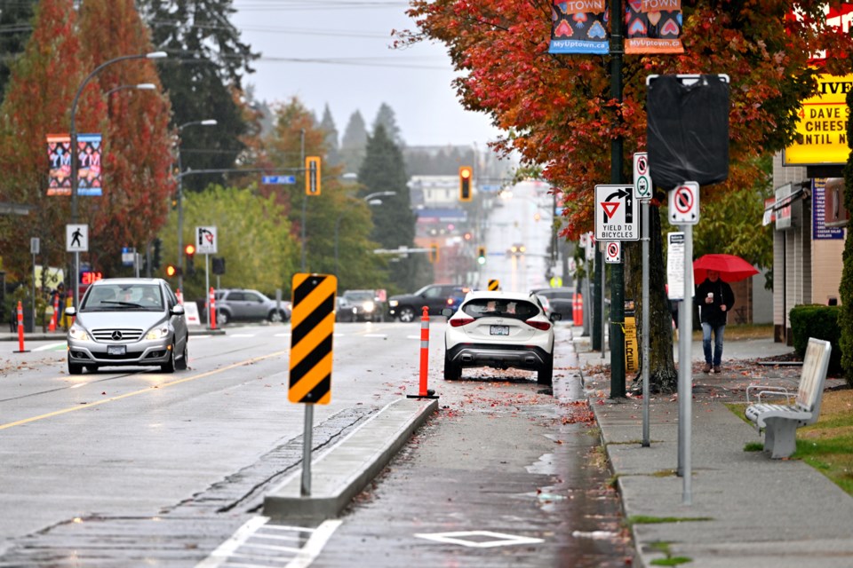 NewWestminsterbikelaneandparkedcar